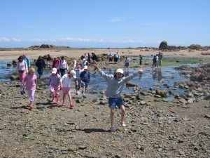 Children on sea shore in Jersey