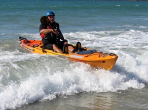 Andy Benham with Tarpon kayak landing in small surf