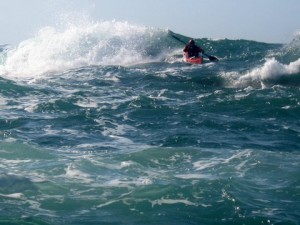 Sea kayak in large waves offshore jersey