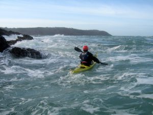sea kayak in tide race. 4 star leader training